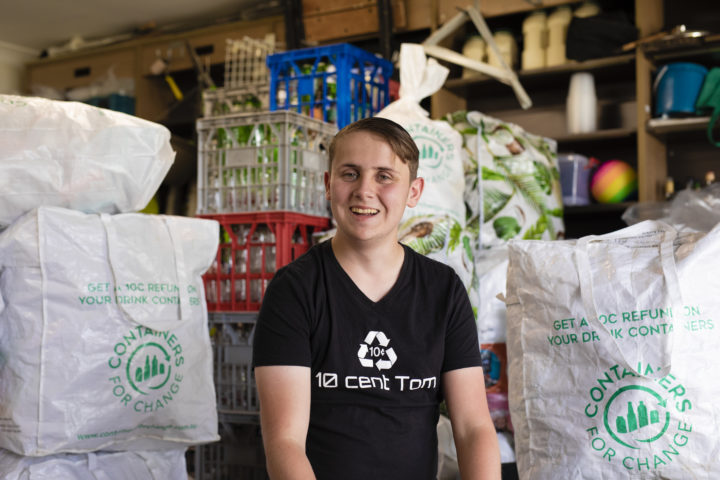 A hand holding a plastic bottle into a recycle bin  AI-generated content may be incorrect.100,000 Containers Saved from Landfill at Pacific Fair Shopping Centre | Containers for Change QLD